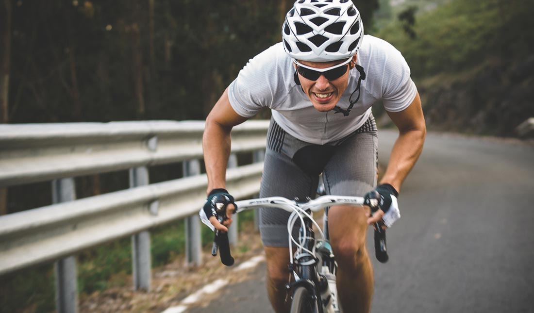 cyclist pedaling on road