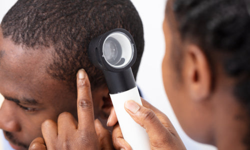 dermatoscope examining scalp