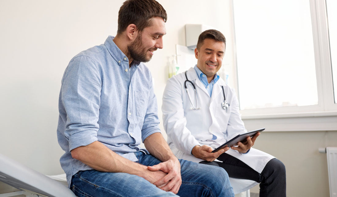 doctor sharing tablet device with patient