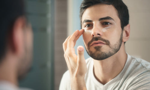 man applying lotion