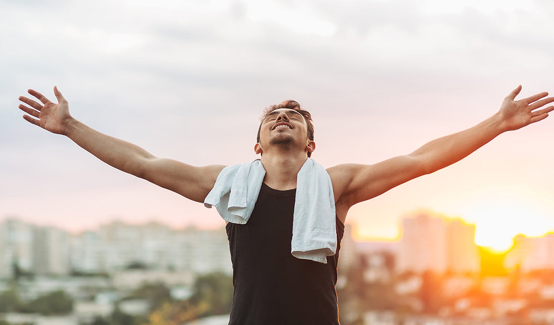 man celebrating after an outdoor workout