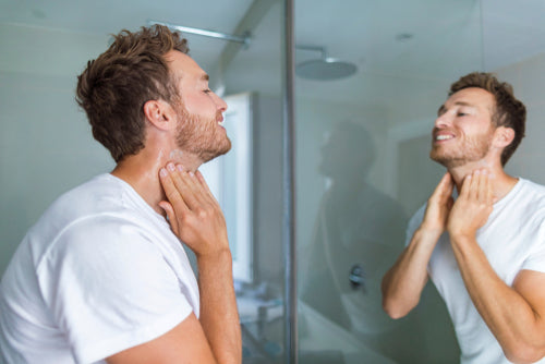 man putting on after shave